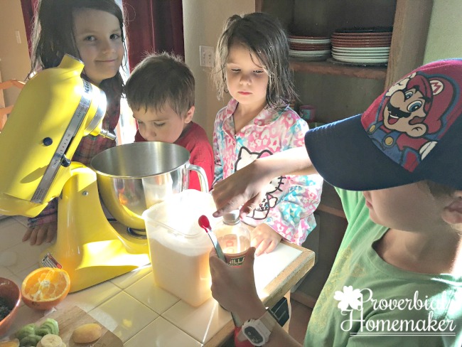 Making cream cheese frosting for the cytoplasm of a fruit pizza edible cell model!