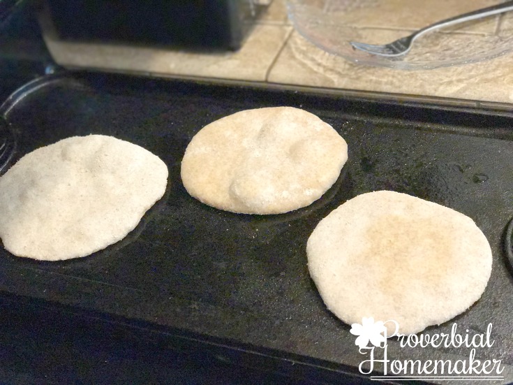 Using a cast iron griddle to brown the dough for this easy flatbread recipe. 